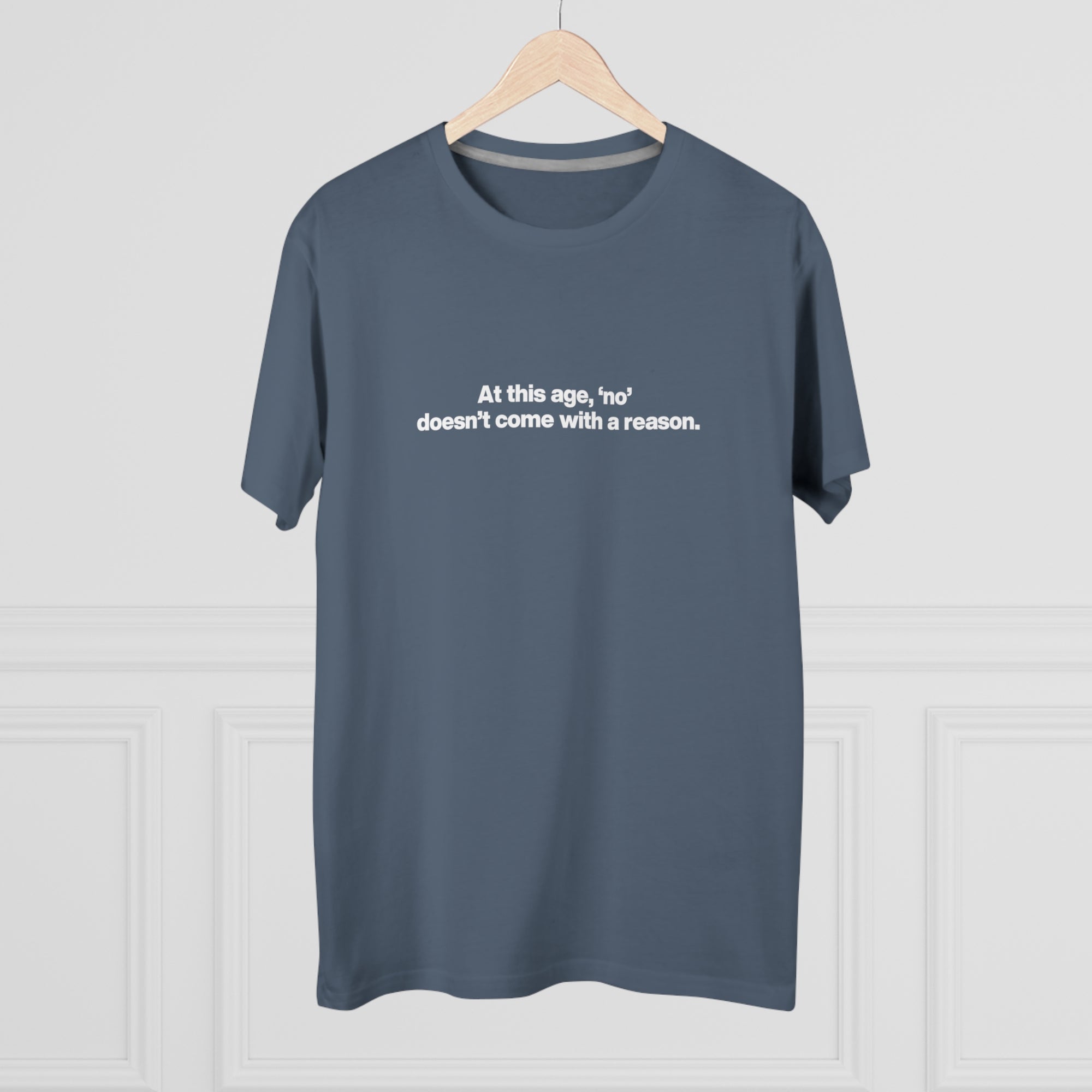 Men's Tee — "At this age, 'no' doesn't come with a reason." Minimalist Statement Shirt