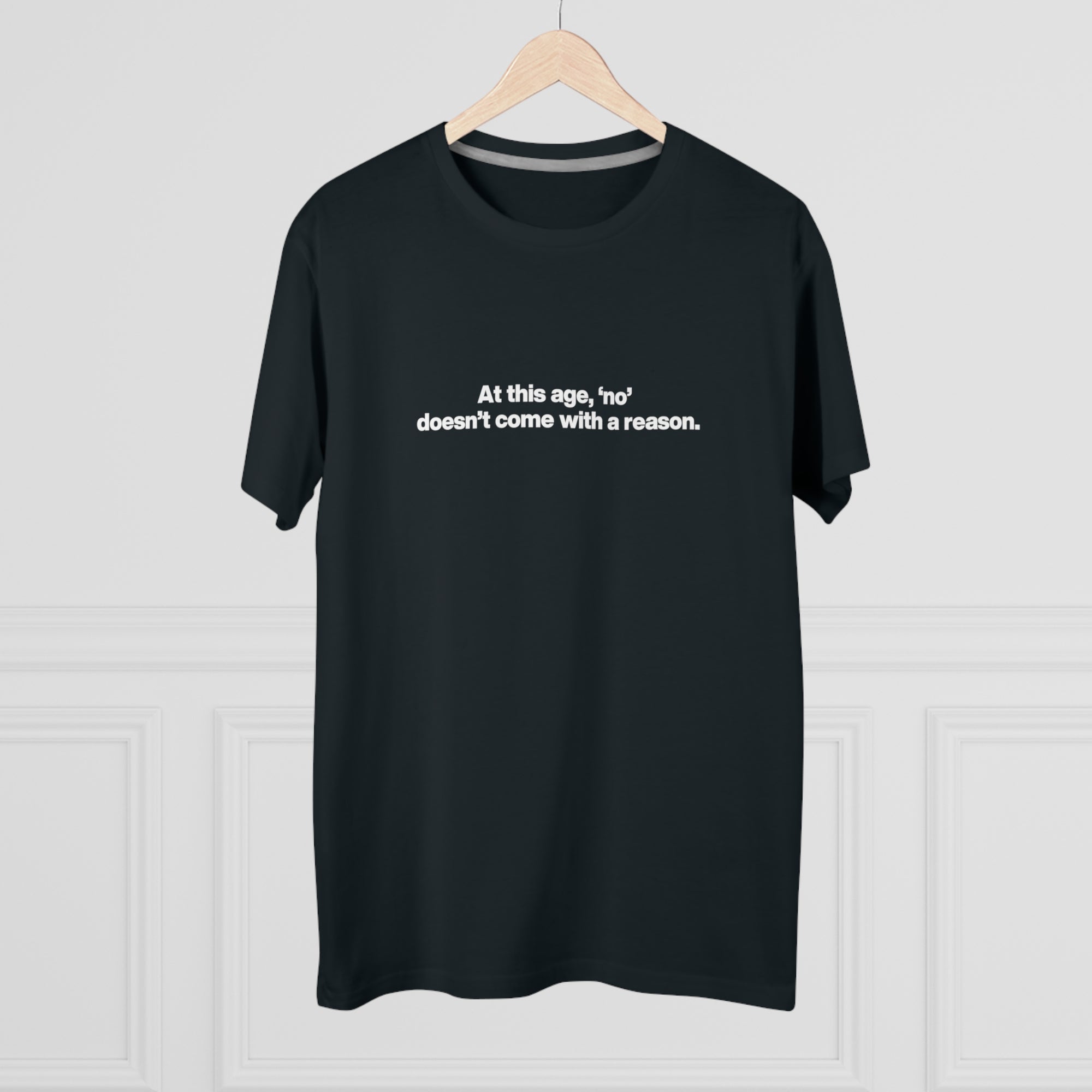 Men's Tee — "At this age, 'no' doesn't come with a reason." Minimalist Statement Shirt